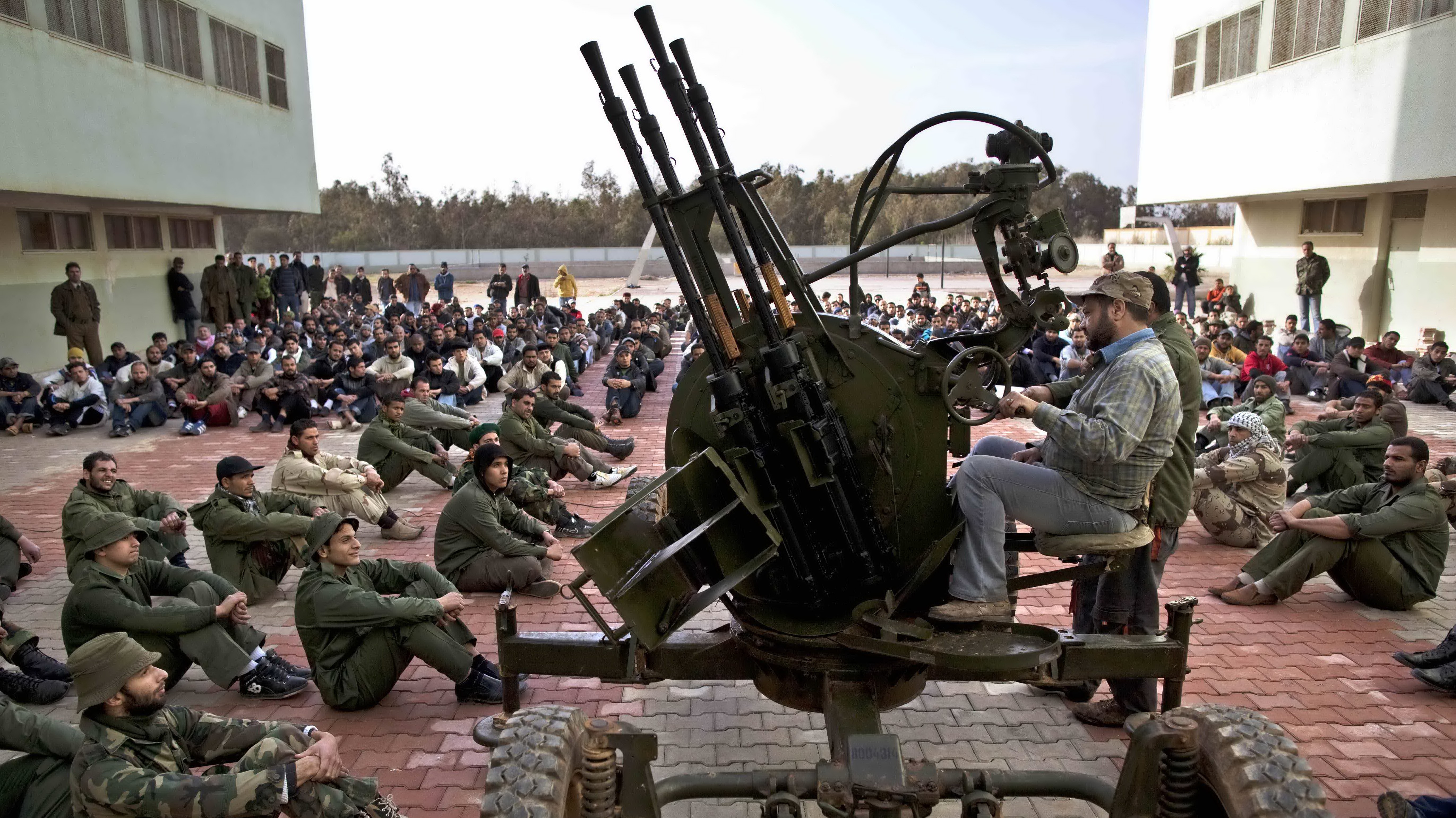Výcvik príslušníkov formujúcej sa armády, ktorá bude bojovať proti Kaddáfímu